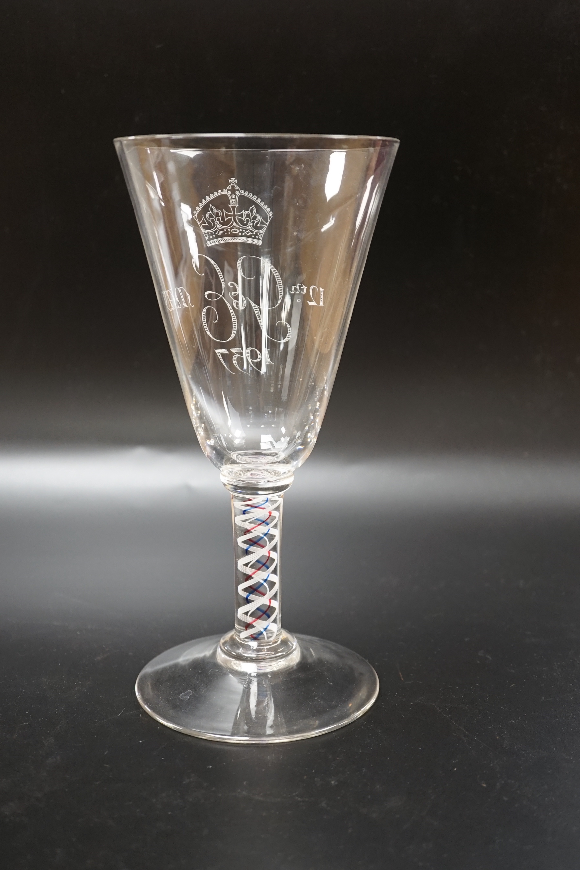 A large George VI commemorative trumpet goblet with etched glass design and cypher dated 1937, stem with red, blue and white colour twist, 22.9cm high